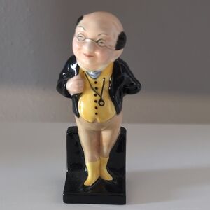Charming Ceramic Figurine with Black and Yellow Accents